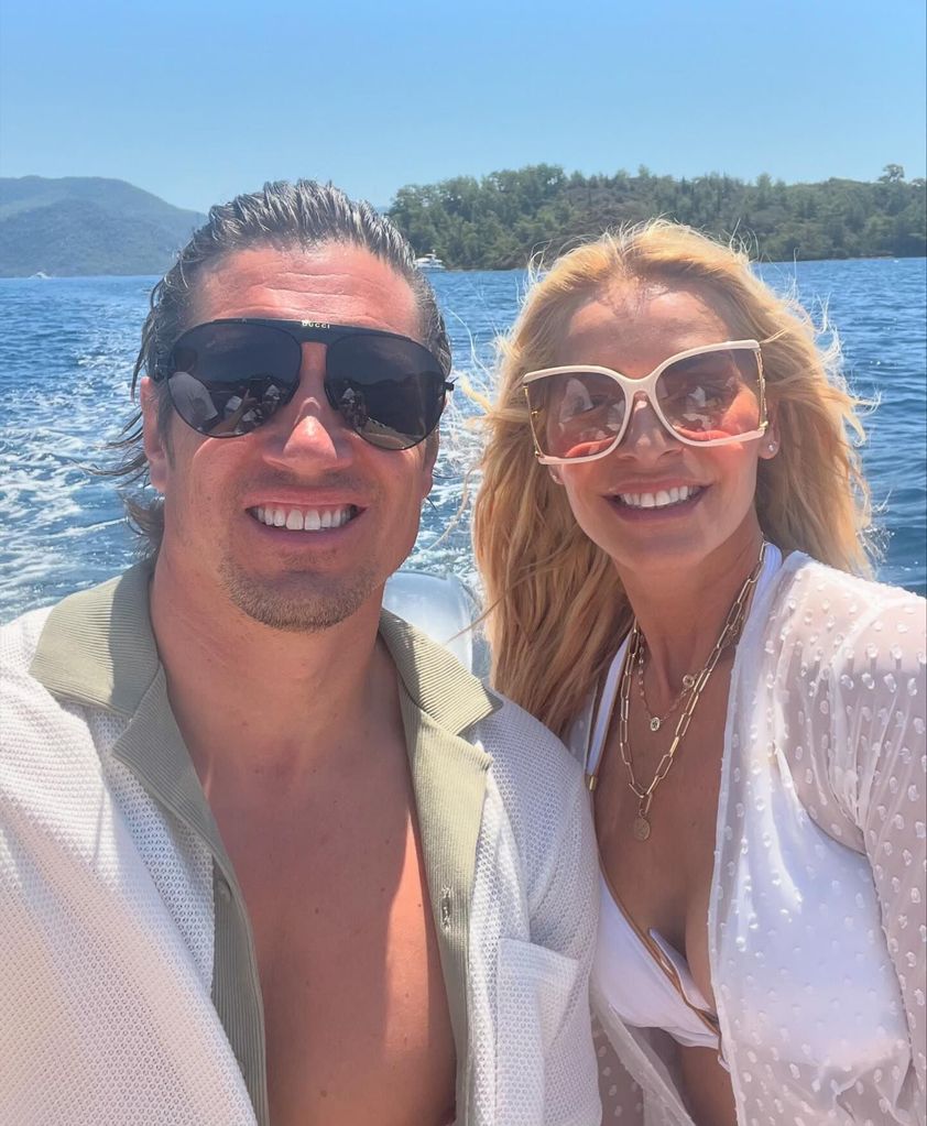 couple posing for selfie on boat 