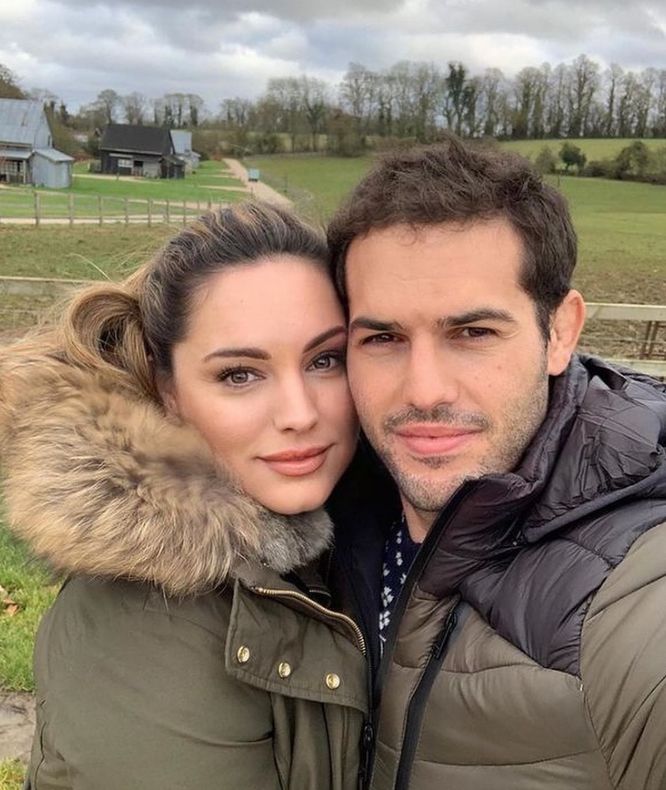 Jeremy Parisi and Kelly Brook cuddling in matching puffer jackets