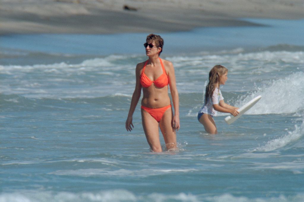 princess diana in the sea wearing orange bikini 