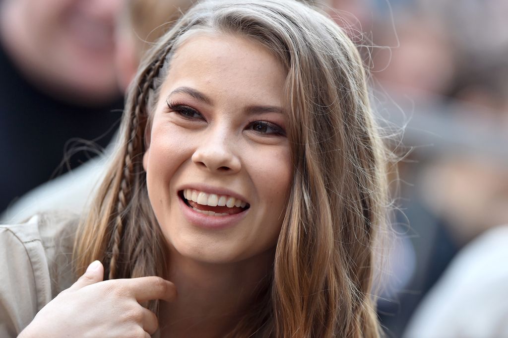 Bindi Irwin beamed at the camera wearing one small plait in her hair