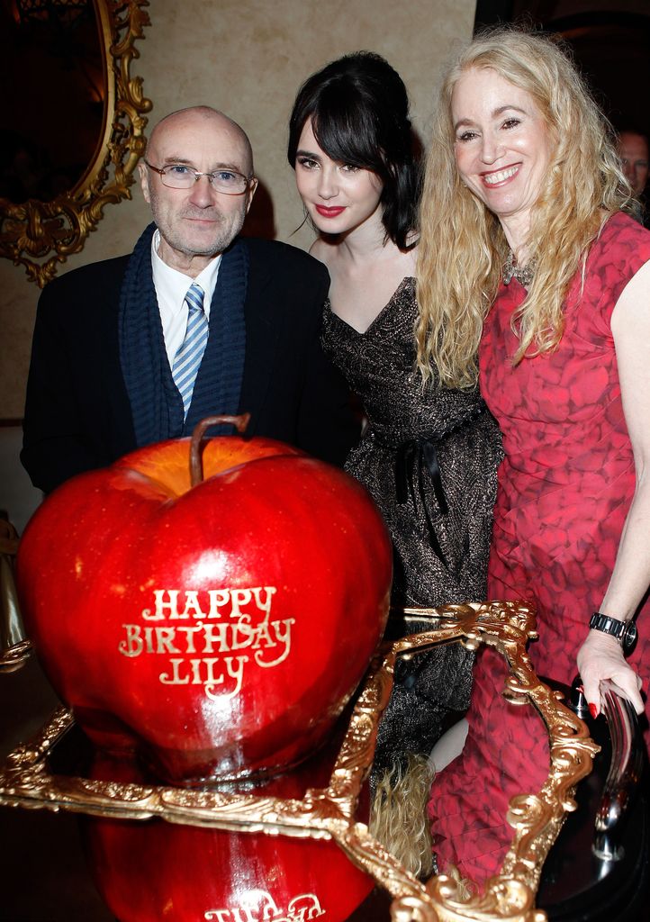 Musician Phil Collins, actress Lily Collins, and Jill Tavelman  at the afterparty for Mirror Mirror 