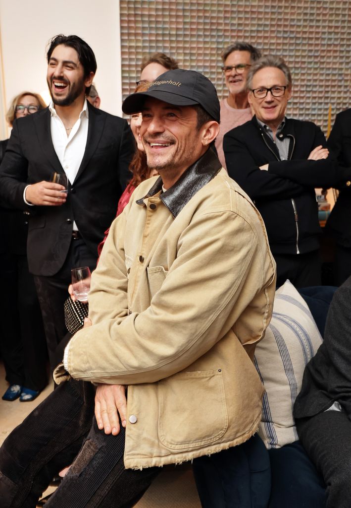 Orlando Bloom wearing prada beige jacket