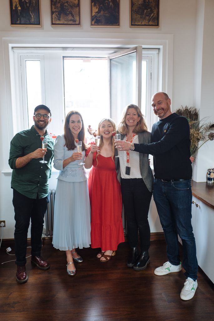 Cheers to history! Elizabeth raises a glass with (left to right) HELLO! Video Editor Vali Raza, Reporter Isabelle Casey, Head of Digital Sophie Vokes-Dudgeon, and Head of Channels Christian Anderson-Ramshall