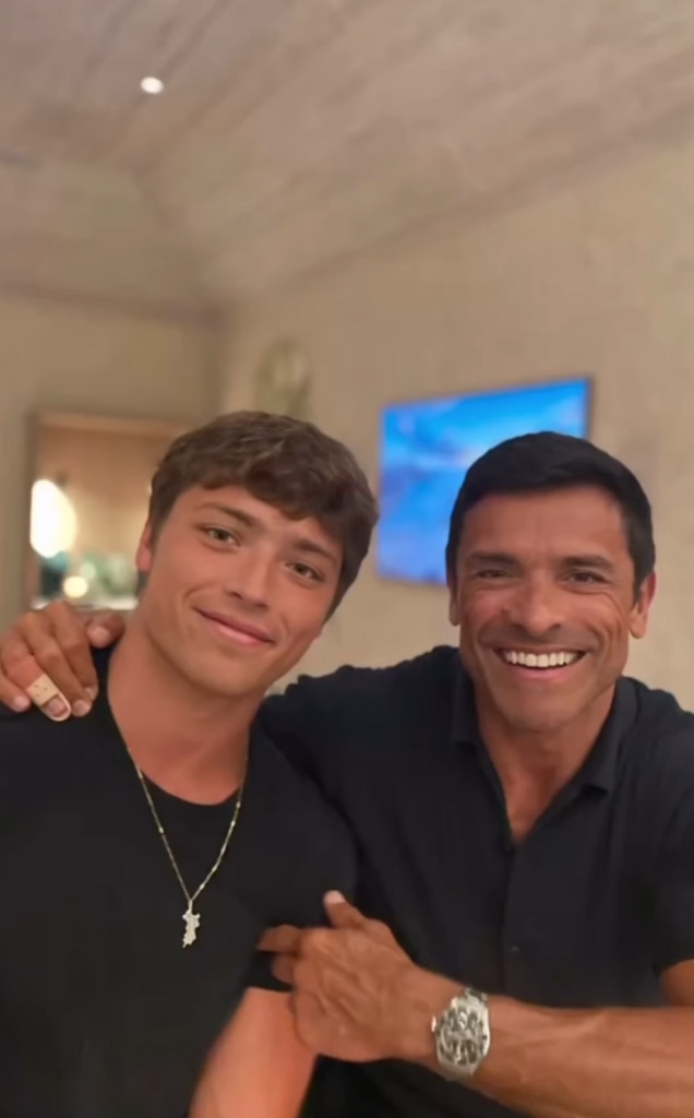 Clip of a video montage shared by Kelly Ripa on Instagram September 2023 where her husband Mark Consuelos is posing next to their son Joaquin during their beach vacation with their kids.