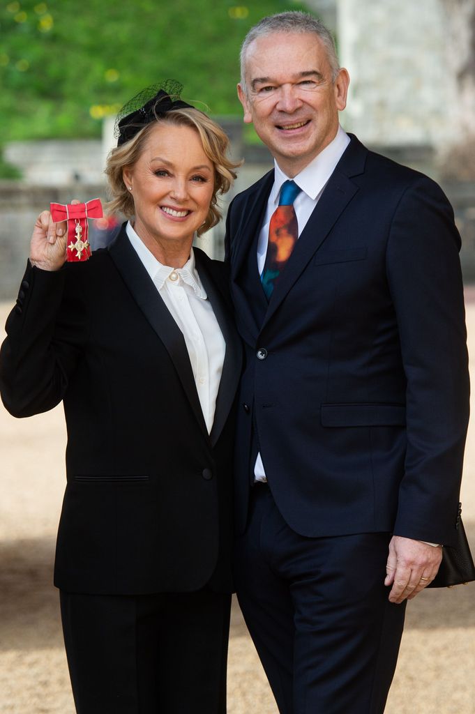 Sally Dynevor with husband Tim Dynevor after being awarded an MBE for services to Drama at Windsor Castle in 2022