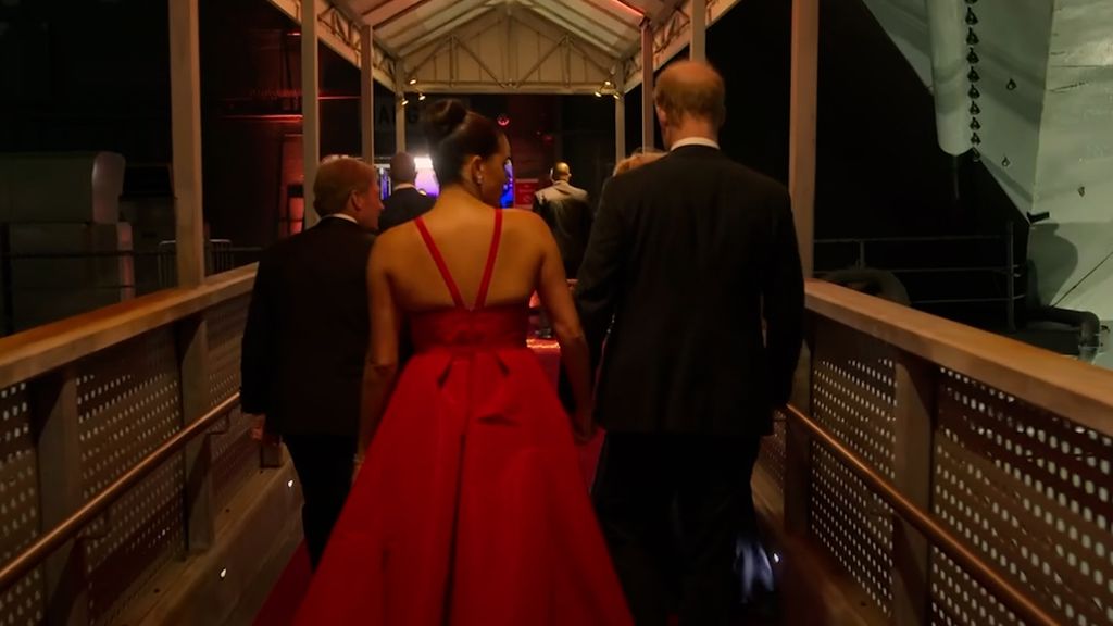 Meghan Markle's 'dominant' red hot gown defies royal rules in new clip
