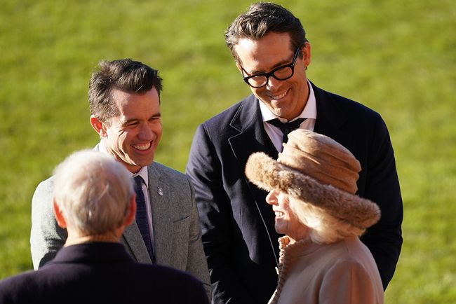 Queen Consort Camilla laughs with Ryan Reynolds at Wrexham AFC