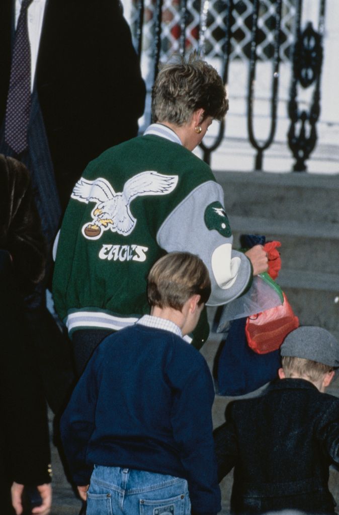 Diana  Princess of Wales  (1961 - 1997) wearing a Philadelphia Eagles jacket to drop off her son Prince Harry at Wetherby School in London, January 1991. Prince William is accompanying them. (Photo by Jayne Fincher/Princess Diana Archive/Getty Images)