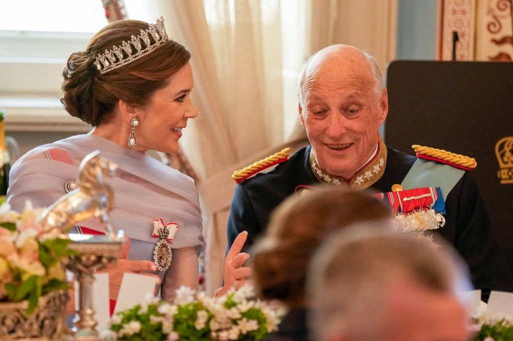 Queen Mary laughs with King Harald 
