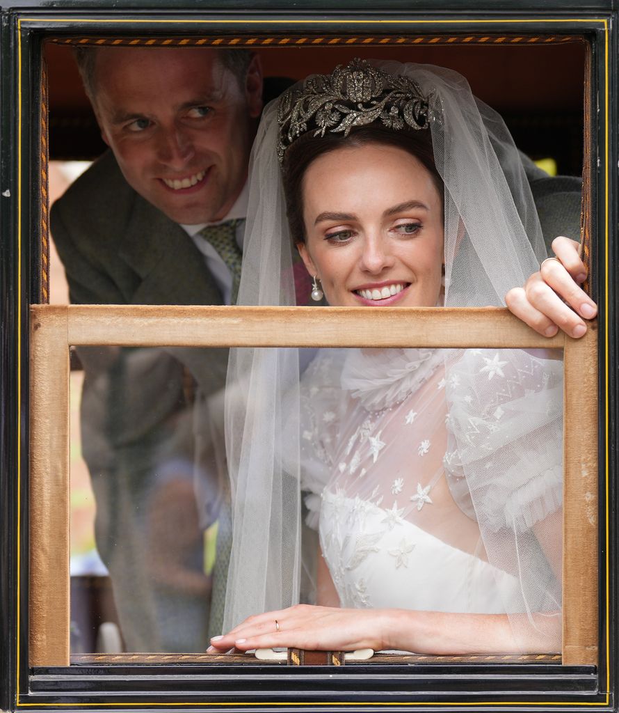 Lady Violet Manners peered out of the wedding car