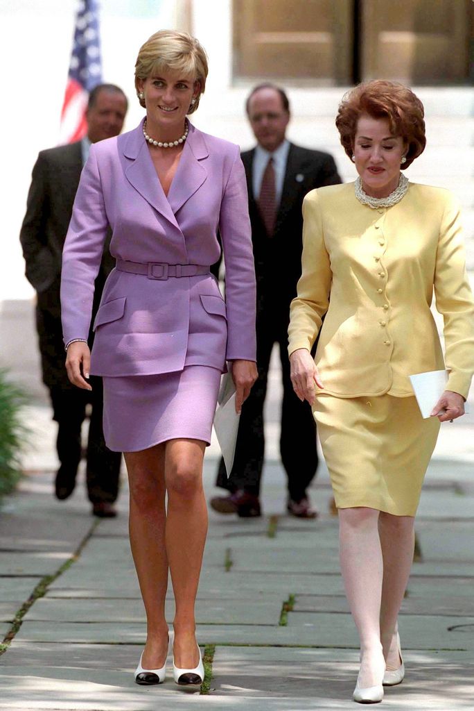Princess Diana wearing a lilac suit with Elizabeth Dole,  President Of The American Red Cross, At The Red Cross Headquarters in Washington.  
