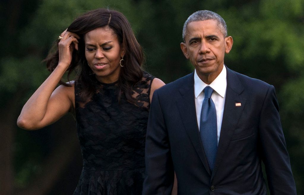 Michelle and Barack Obama look serious