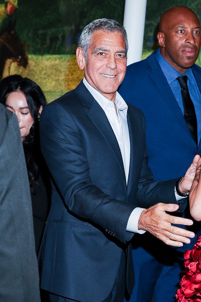 George Clooney in navy suit during Jay Kelly after party