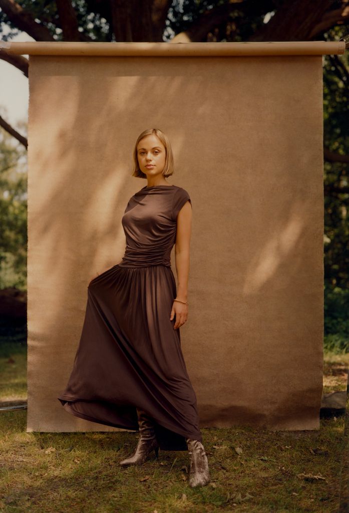 amelia windsor in a dark dress looking serious