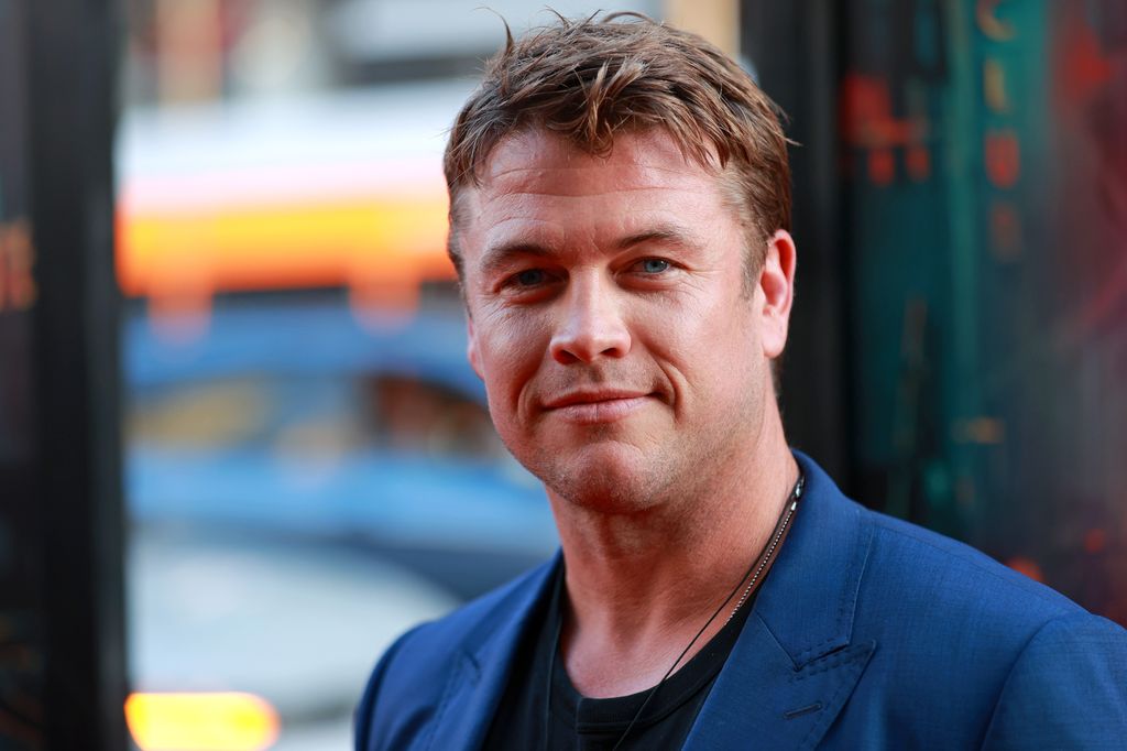 Luke Hemsworth in a blue suit