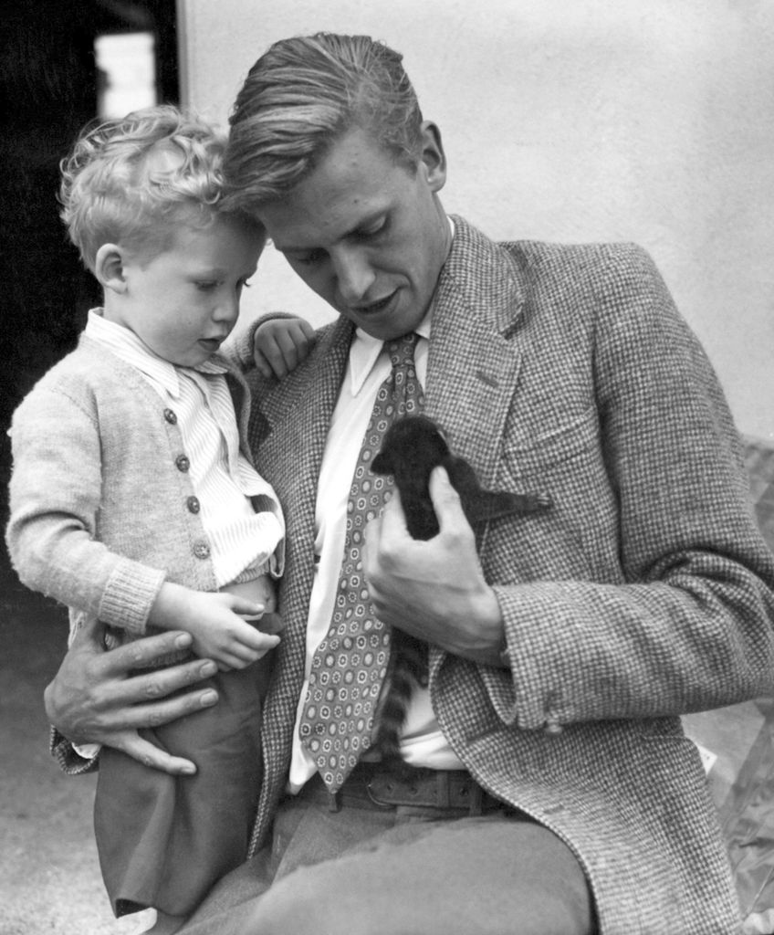 David Attenborough and his young son with David holding a small animal