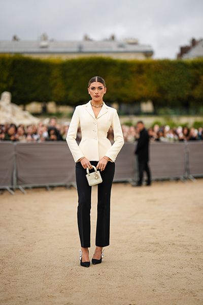 Woman Wearing Black Cigarette Trousers With Peplum Jacket