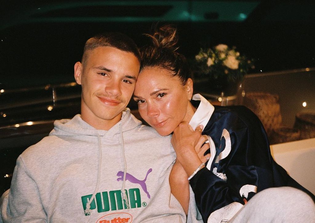 Romeo and Victoria Beckham cuddled up together