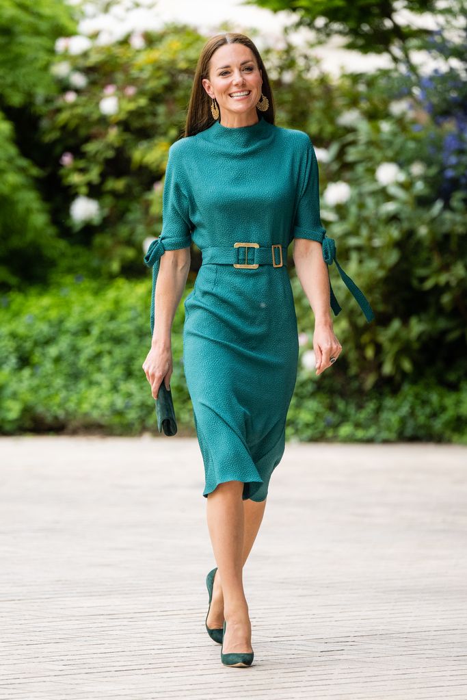 Kate Middleton wearing a turquoise dress arrives to present The Queen Elizabeth II Award for British Design at an event hosted by the British Fashion Council at Design Museum on May 04, 2022 in London, England.