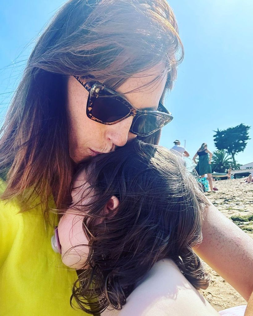 alex jones kissing daughter on head at beach