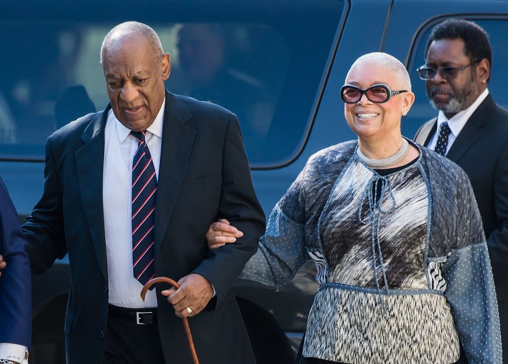 Bill and wife walking arm in arm 