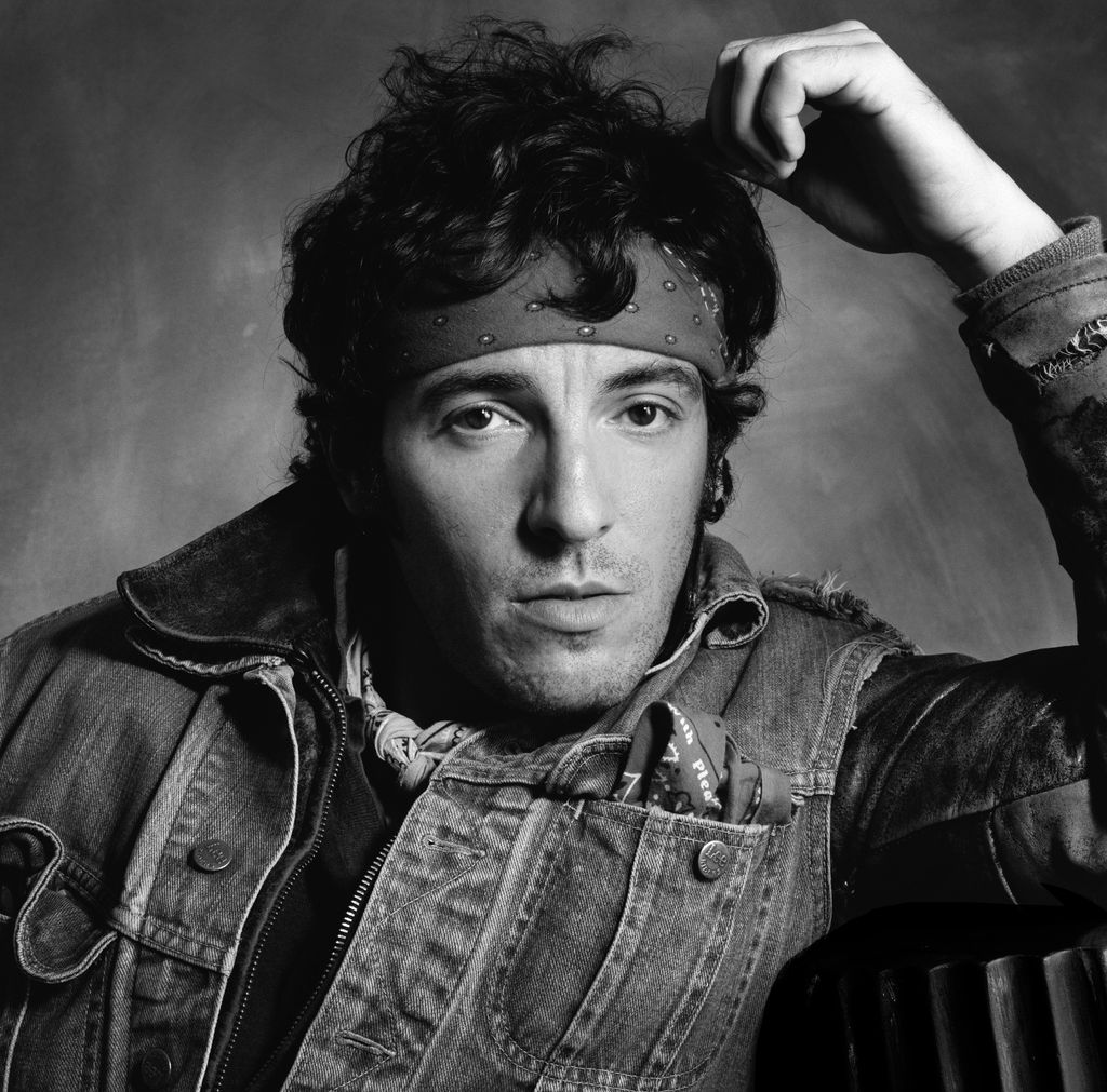 A black-and-white photo of a young Bruce Springsteen