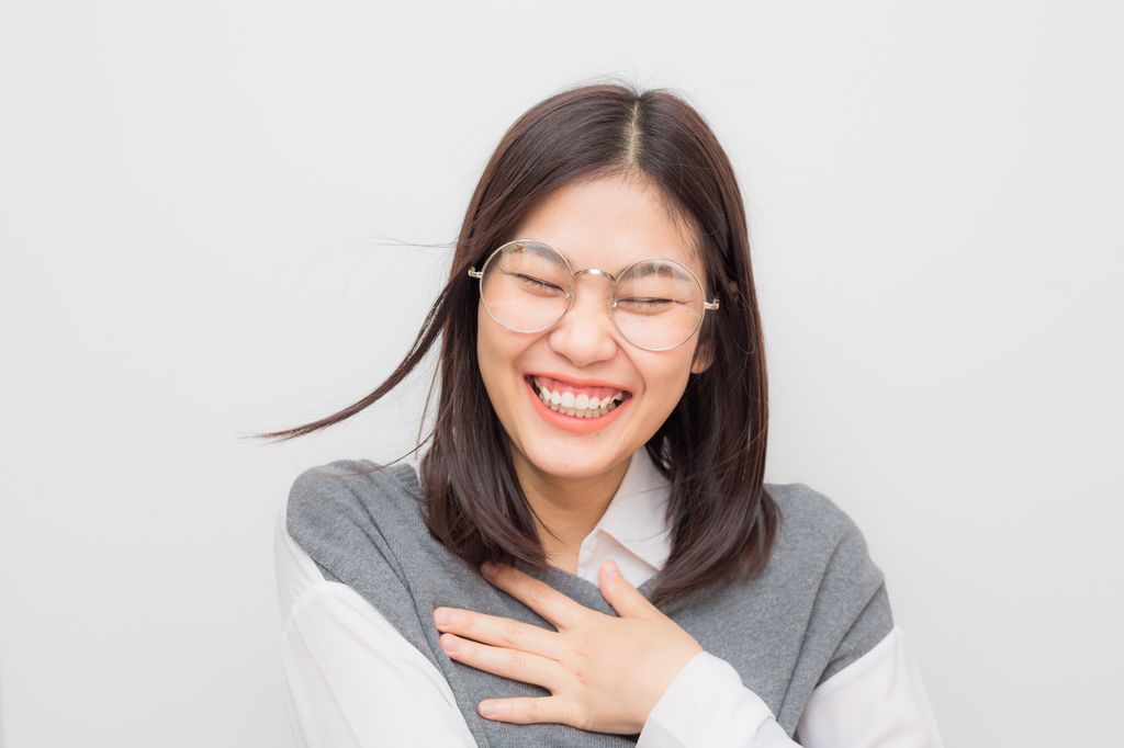 Young woman laughing merrily