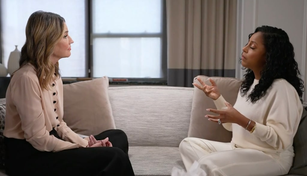 Sheinelle Jones in white outfit sat on sofa with Savannah Guthrie