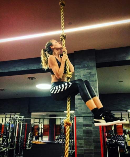 Victorias Secret Angel Josephine Skriver climbing a rope at the gym