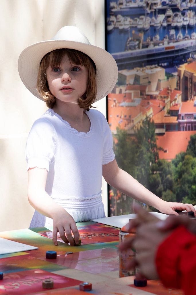 Princess Gabriella of Monaco takes part in a painting workshop during celebrations to mark the birth of the late Rainier III in Monaco 