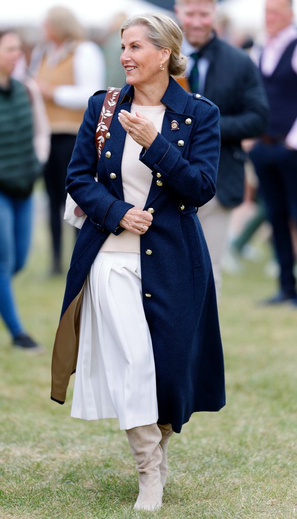 duchess sophie in pleated white skirt and navy coat