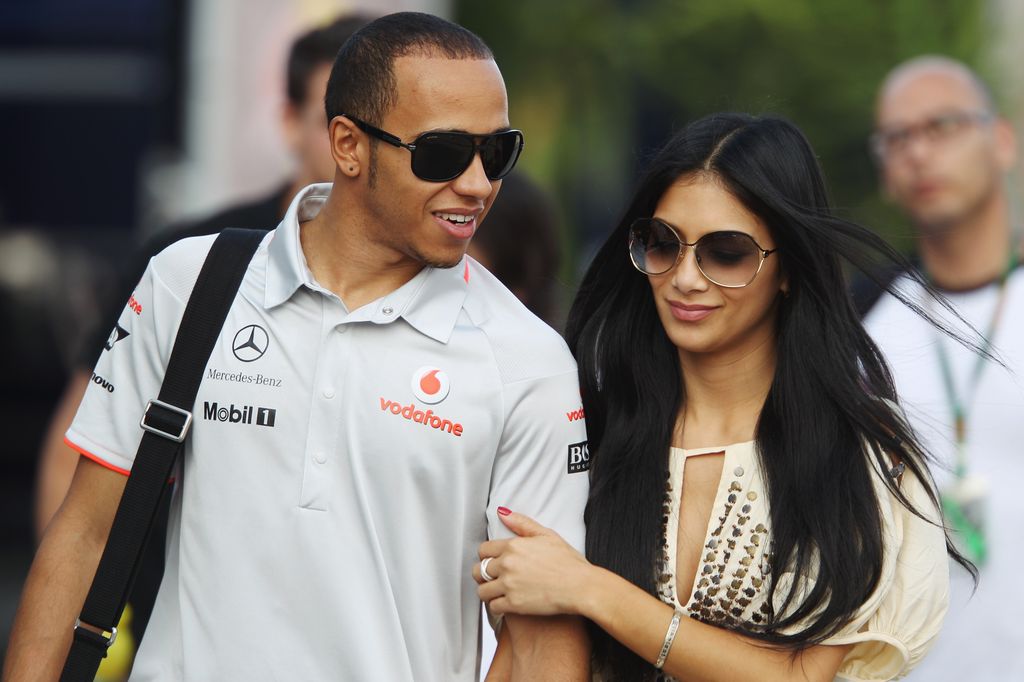 ISTANBUL, TURKEY - MAY 29:  Lewis Hamilton of Great Britain and McLaren Mercedes and his girlfriend Nicole Scherzinger of the Pussycat Dolls walk in the paddock following qualifying for the Turkish Formula One Grand Prix at Istanbul Park on May 29, 2010, in Istanbul, Turkey.  (Photo by Mark Thompson/Getty Images)