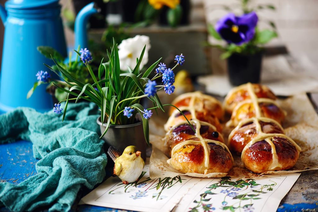 hot cross buns on table with flowers