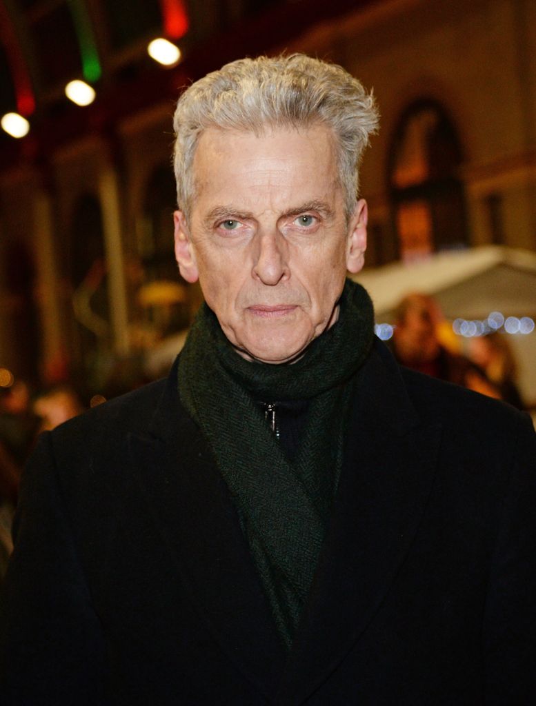 Peter Capaldi in a coat and scarf