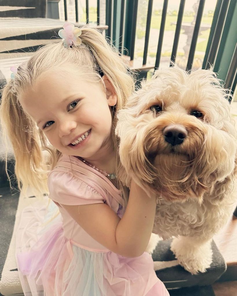 Jessica's daughter Birdie with the family dog