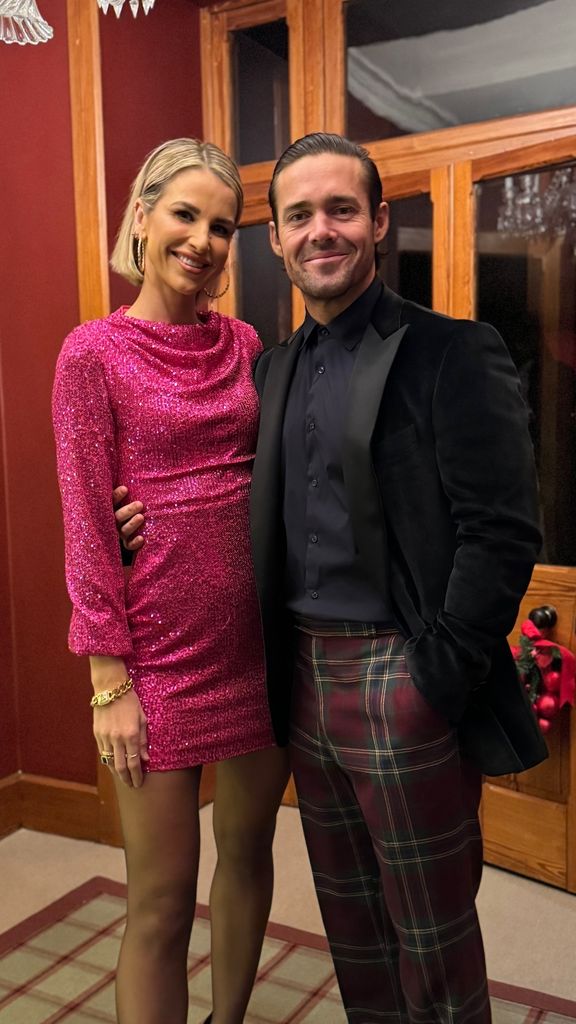 Vogue Williams wearing pink dress beside her husband Spencer Matthews