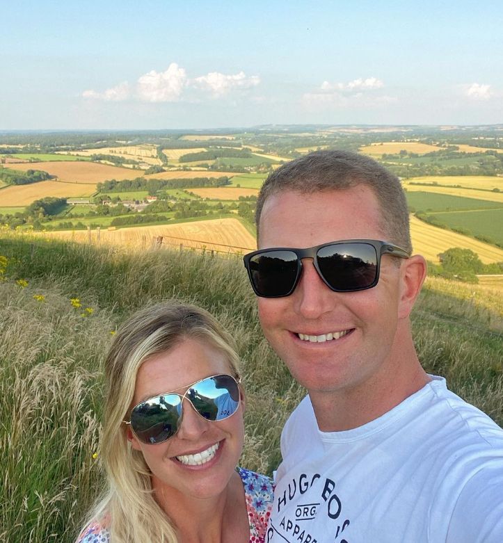 Georgie and Jesse Campbell smiling with fields behind them