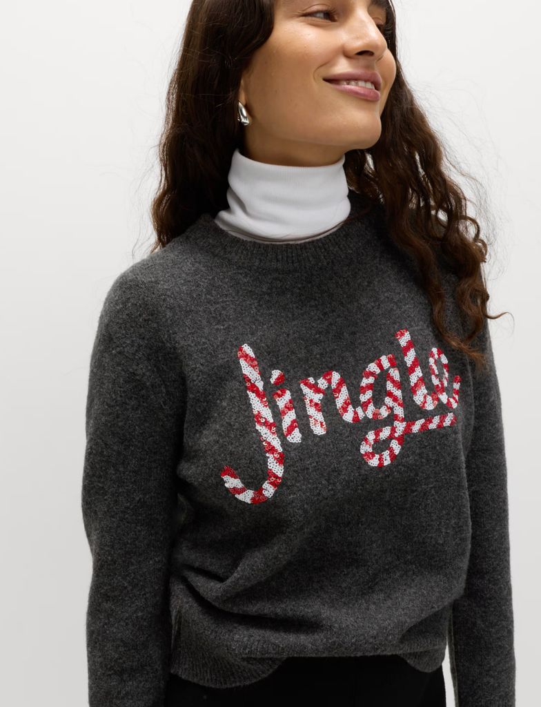 Grey Marks & Spencer jumper with red and white candy stripe jingle across the front