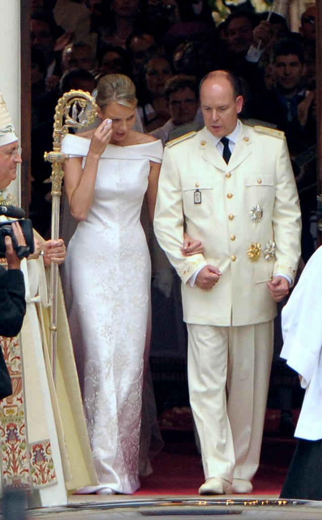 Princess Charlene on her wedding day crying beside albert