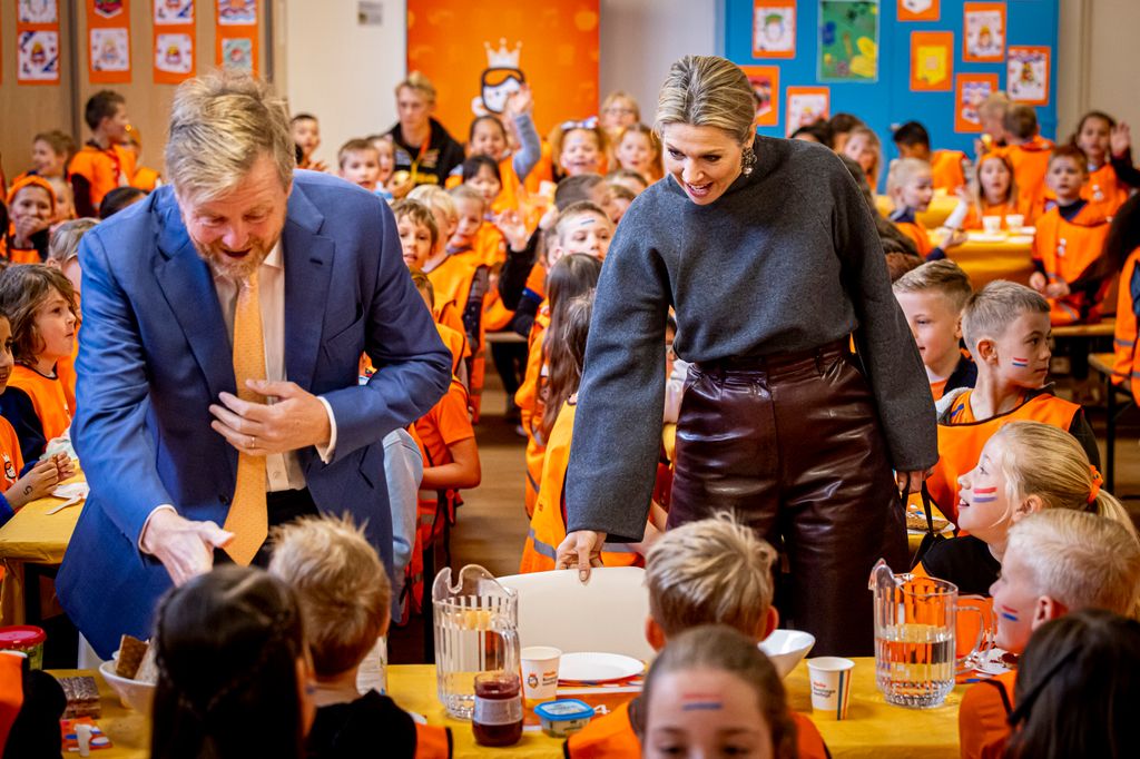 King Willem-Alexander and Queen Maxima at a school with children