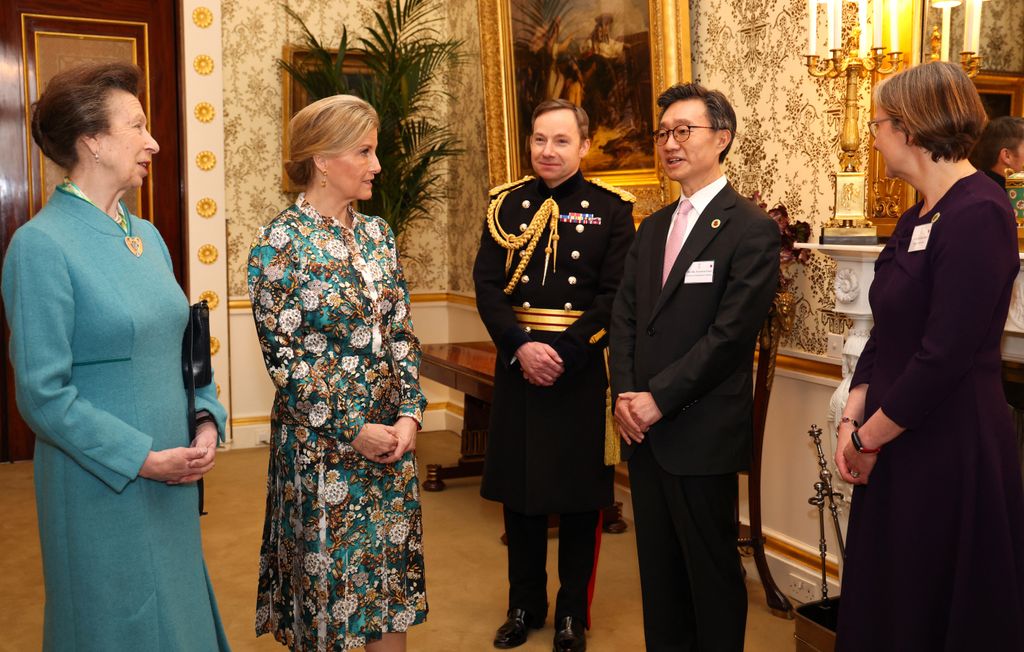 Princess Anne and Duchess Sophie talking with South Korea's Ambassador to the United Kingdom, Yoon Yeocheol
