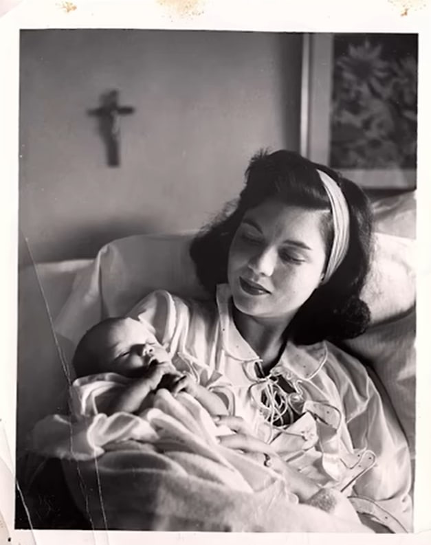 Marjorie Finlay holds her baby daughter circa 1958