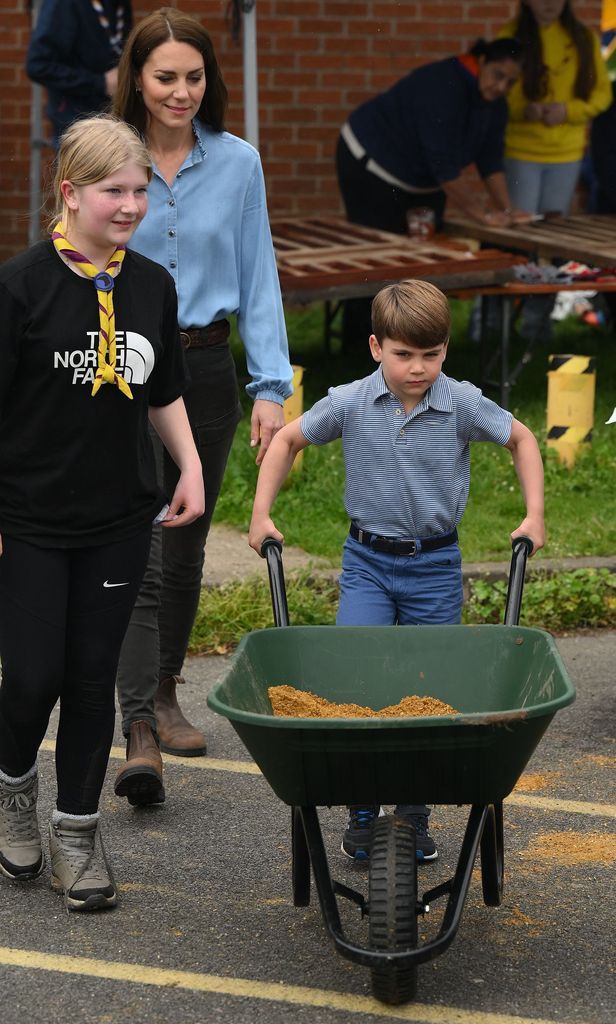 Prince Louis took control of a wheelbarrow as he helped his mother  take part in the Big Help Out  during a visit to the 3rd Upton Scouts Hut in Slough