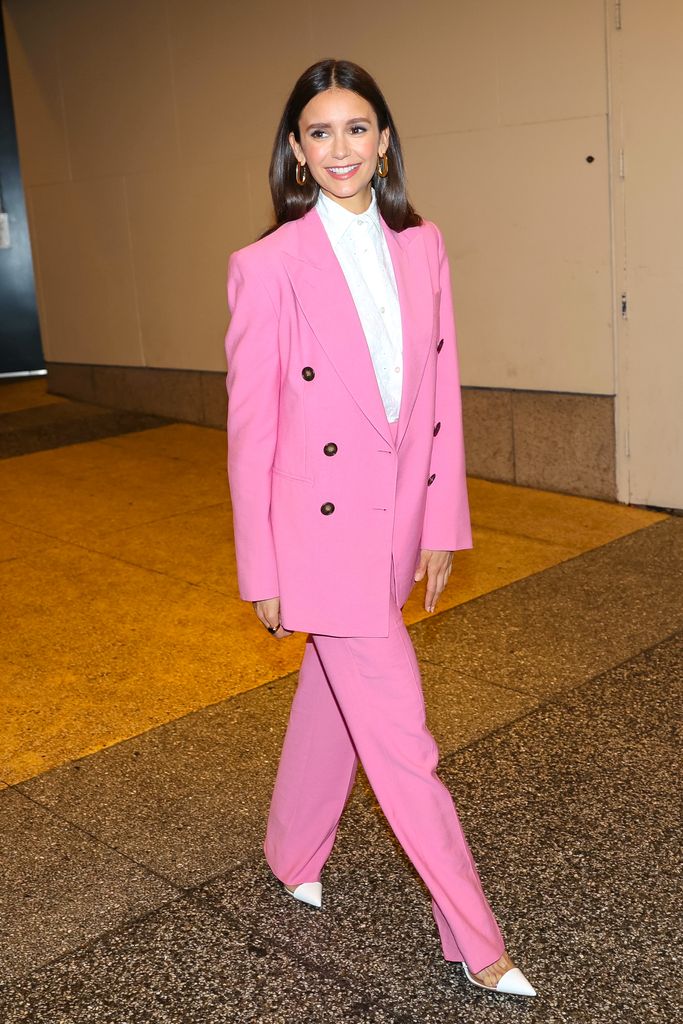 Nina Dobrev delighted onlookers in NYC in a power pink crafted out of the prettiest pink material