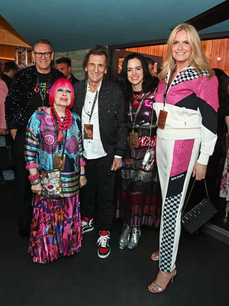 Penny posing alongside Mark Aldridge, Dame Zandra Rhodes, Ronnie Wood and Sally Wood at the 1st anniversary performance of "ABBA Voyage" at the ABBA Arena 