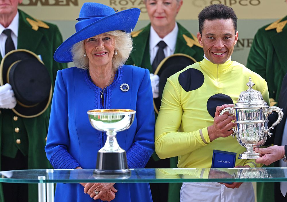 Queen Camilla on stage to present The St James’s Palace Stakes to Jockey Sean Levey rider of Rosallion