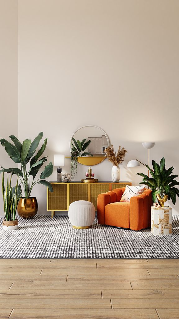 An orange loveseat in a living room decorated with lots of plants, a wooden sideboard and round gold mirror
