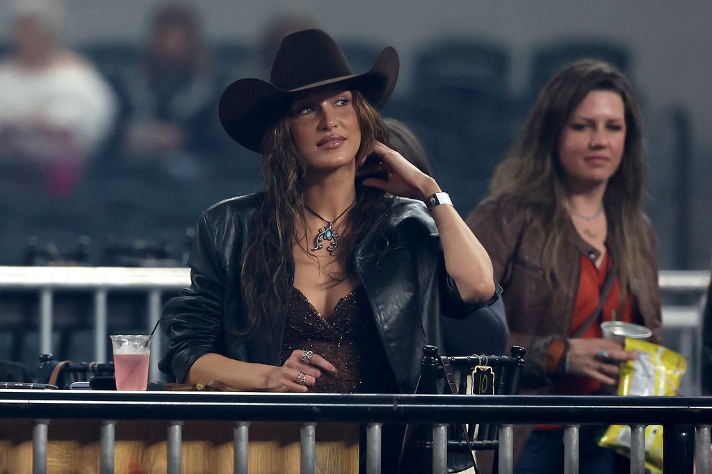 Bella Hadid looks on during The American Performance Horseman by Teton Ridge at Globe Life Field on March 08, 2024 in Arlington, Texas. (Photo by Rob Carr/Getty Images for Teton Ridge)