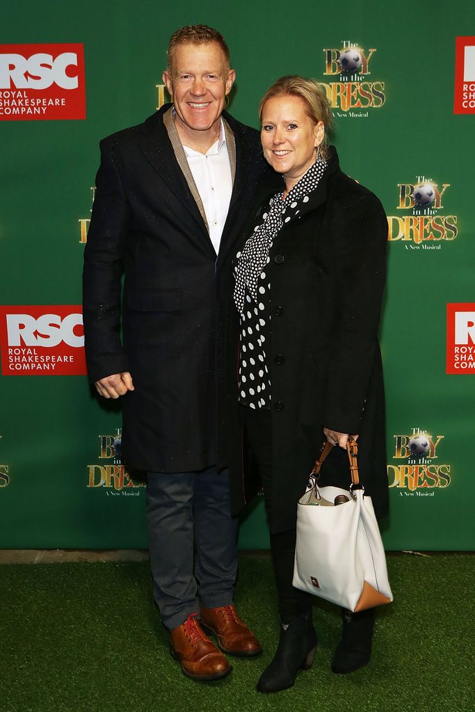 Adam Henson and his wife in matching black coats