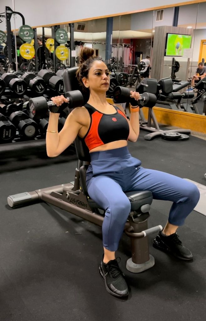 Rajni lifting weights in gym
